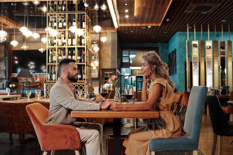 Date Night Special with pizza and wine in romantic restaurant setting